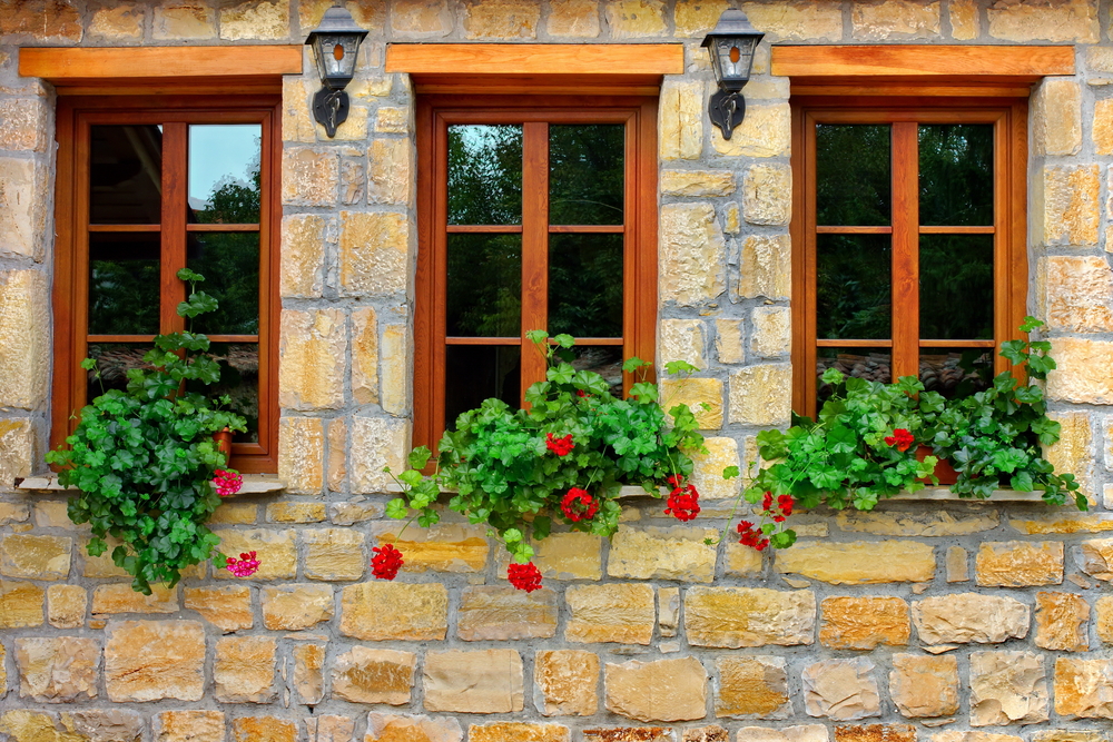 3 wooden windows with added foliage